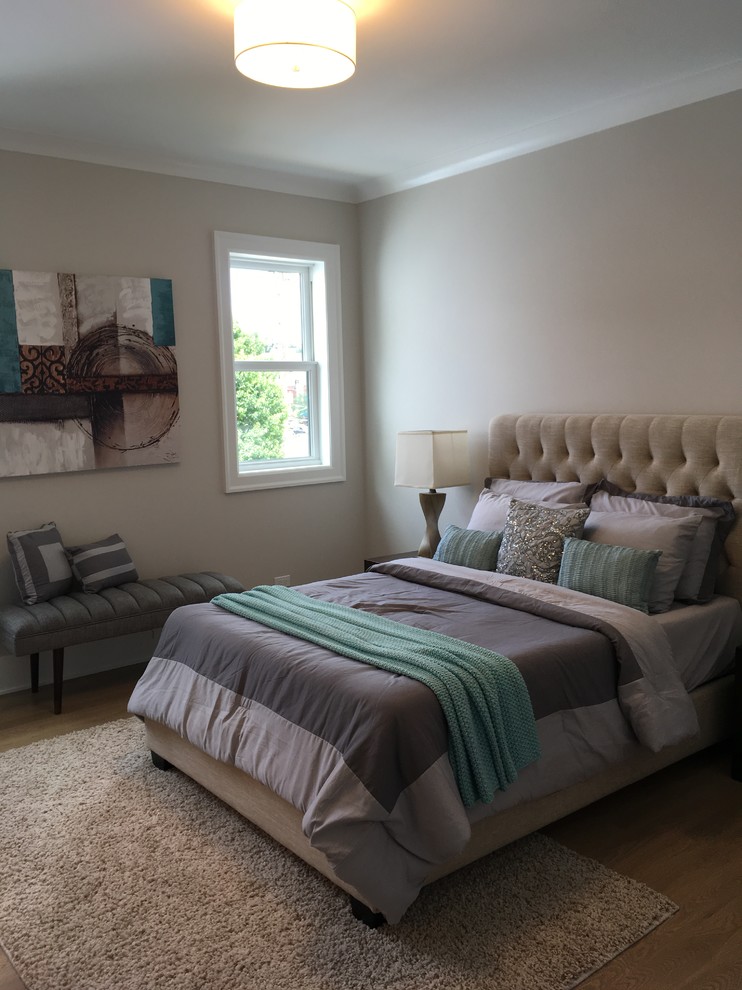 Home design - large transitional guest light wood floor and beige floor home design idea in Chicago with beige walls