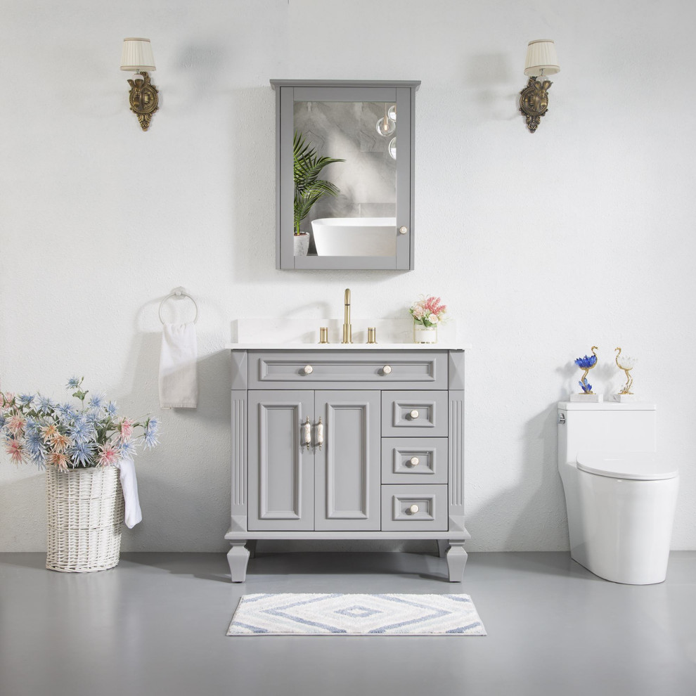 Cette image montre une salle de bain vintage de taille moyenne avec un placard avec porte à panneau encastré, des portes de placard grises, un plan de toilette en marbre, un plan de toilette blanc, meuble simple vasque et meuble-lavabo sur pied.