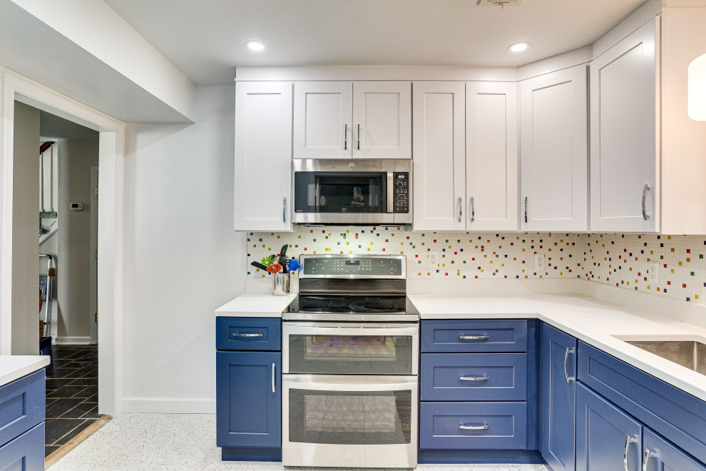 Photo of a small eclectic separate kitchen in DC Metro with an undermount sink, shaker cabinets, quartz benchtops, stainless steel appliances and no island.