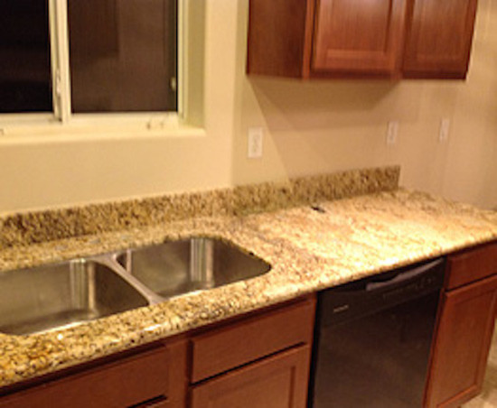Enclosed kitchen - mid-sized l-shaped enclosed kitchen idea in Phoenix with an island