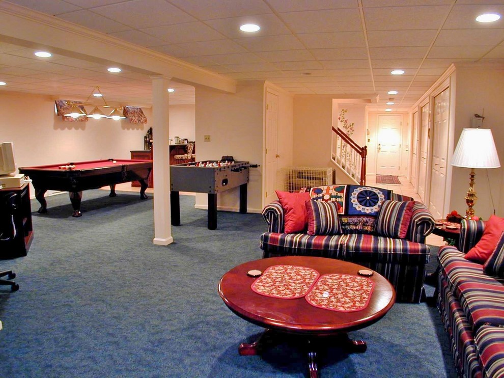 Mid-sized traditional fully buried basement in New York with a game room, beige walls, carpet, no fireplace and blue floor.