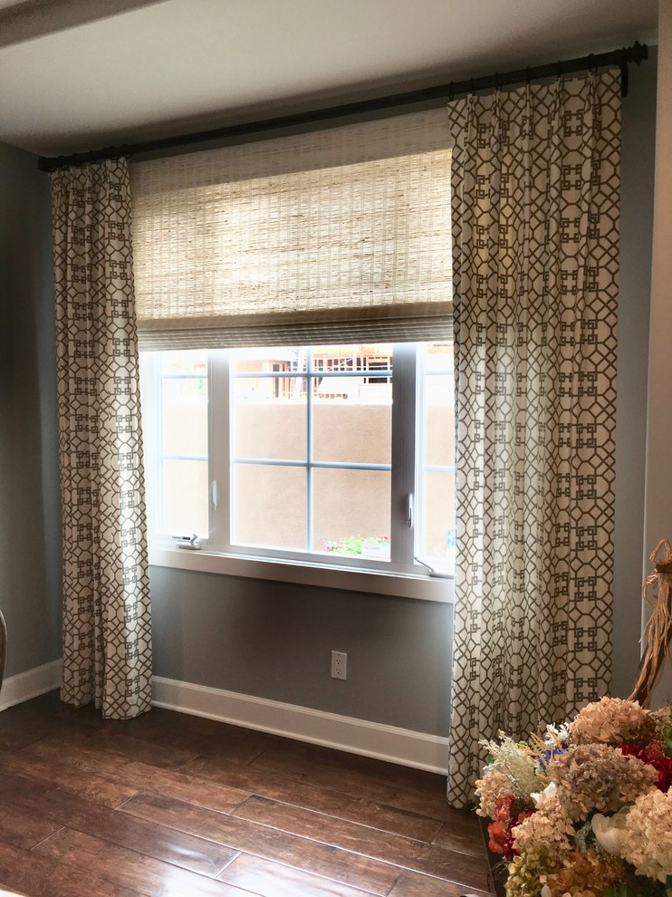Mid-sized transitional medium tone wood floor and brown floor enclosed dining room photo in Orange County with gray walls and no fireplace