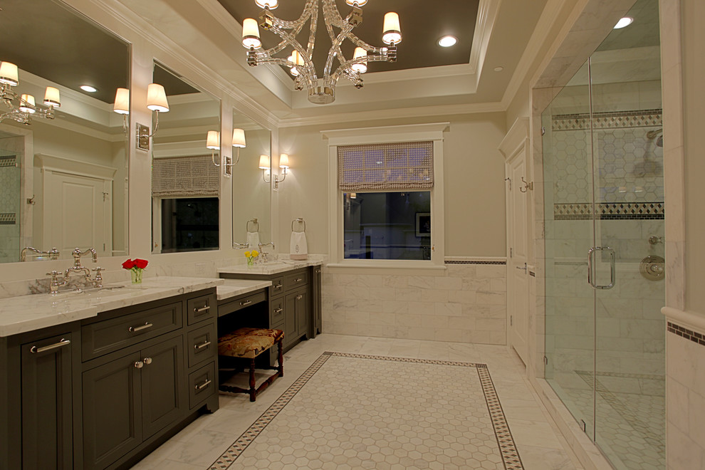 Inspiration for a large traditional master bathroom in Houston with recessed-panel cabinets, dark wood cabinets, white tile, marble benchtops, a double shower, stone tile, white walls, marble floors and an undermount sink.