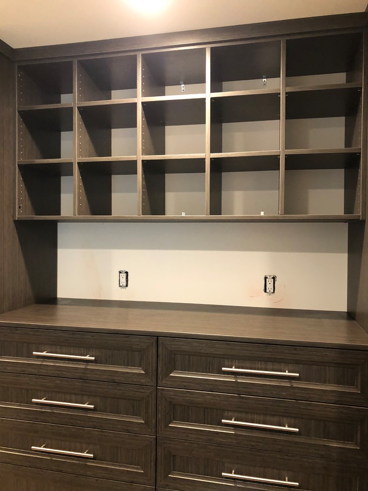 Design ideas for a large transitional gender-neutral walk-in wardrobe in DC Metro with beaded inset cabinets and beige cabinets.
