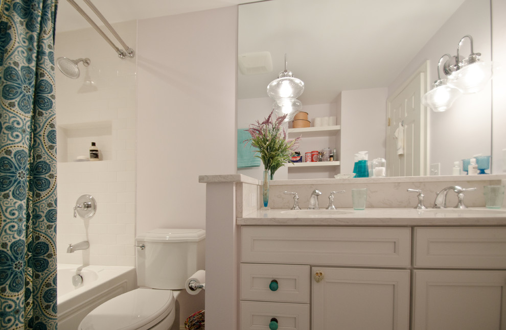 Inspiration for a small traditional kids bathroom in DC Metro with an undermount sink, recessed-panel cabinets, white cabinets, engineered quartz benchtops, an alcove tub, a two-piece toilet, white tile, ceramic tile and purple walls.