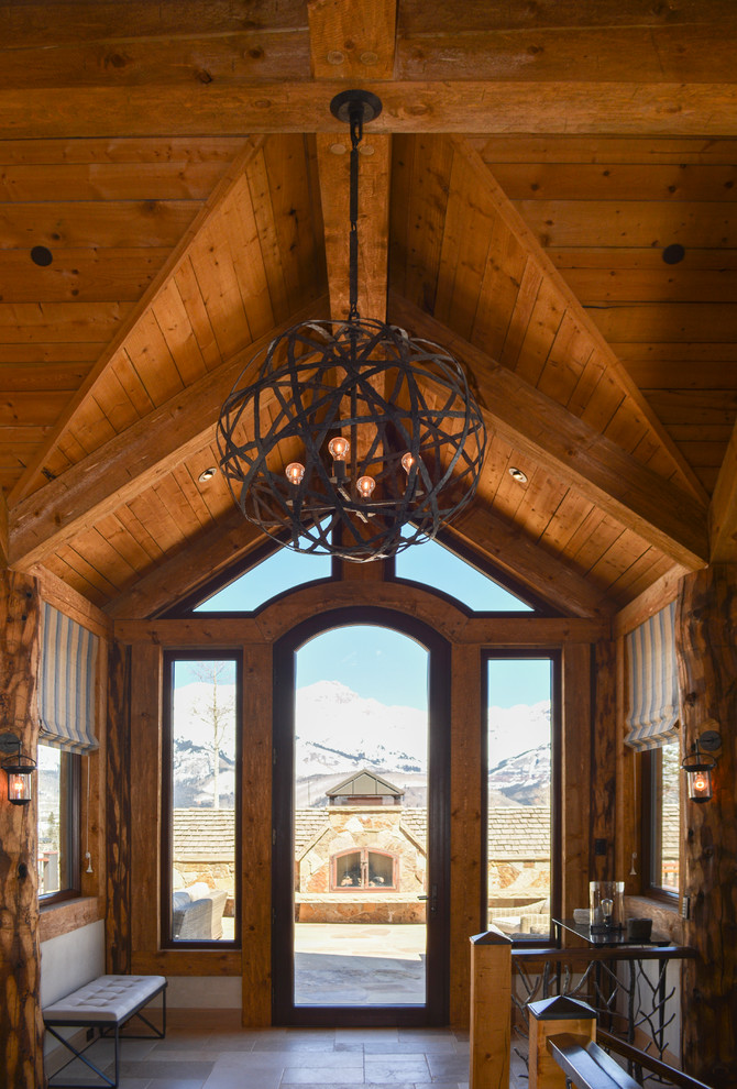Foyer - mid-sized rustic foyer idea in Denver with a glass front door