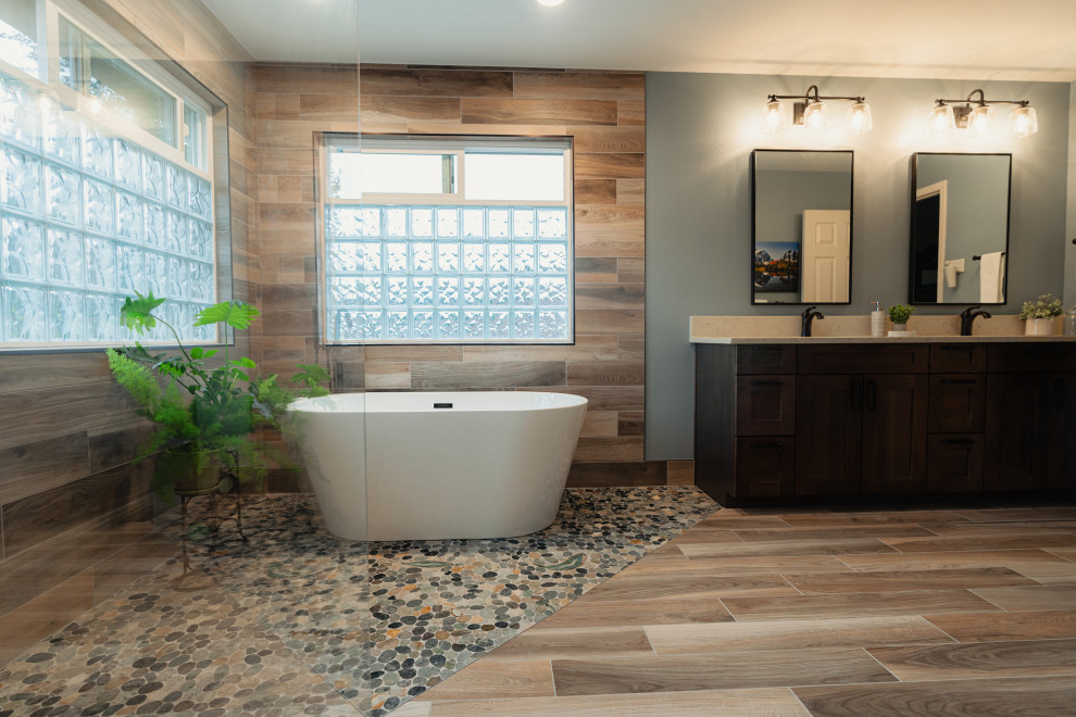 Design ideas for a medium sized rustic ensuite bathroom in Seattle with shaker cabinets, brown cabinets, a freestanding bath, a built-in shower, porcelain flooring, an open shower, a wall niche, double sinks and a built in vanity unit.
