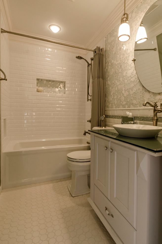Inspiration for a small transitional master bathroom in Chicago with a vessel sink, recessed-panel cabinets, white cabinets, glass benchtops, an alcove tub, an alcove shower, a two-piece toilet, white tile, ceramic tile, green walls and ceramic floors.