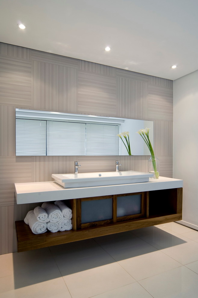 Inspiration for a contemporary beige tile beige floor bathroom remodel in Other with a trough sink, open cabinets and dark wood cabinets