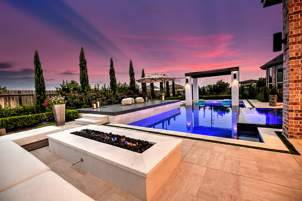 Inspiration for a large contemporary backyard rectangular lap pool in Houston with a hot tub and tile.