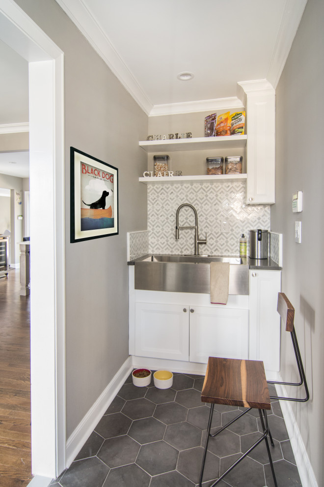 Example of a mid-sized transitional porcelain tile and gray floor mudroom design in Newark with beige walls