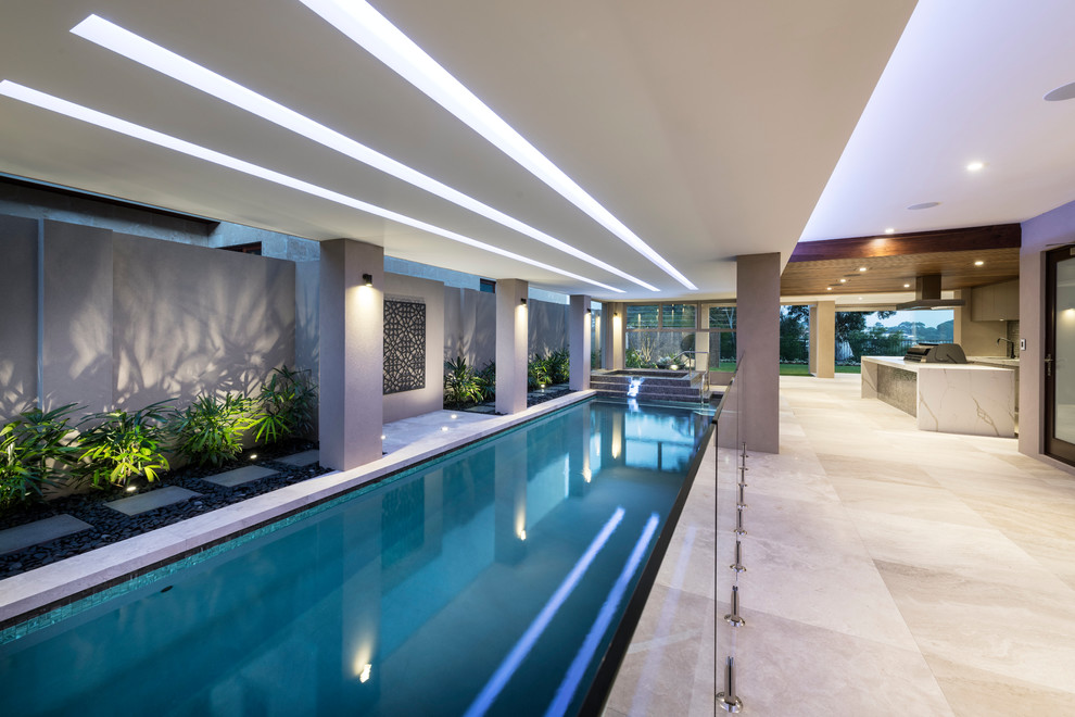 This is an example of a contemporary rectangular lap pool in Sydney with tile.