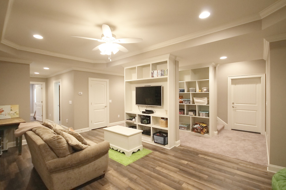 Example of a large transitional light wood floor and brown floor basement design in Other with beige walls and no fireplace