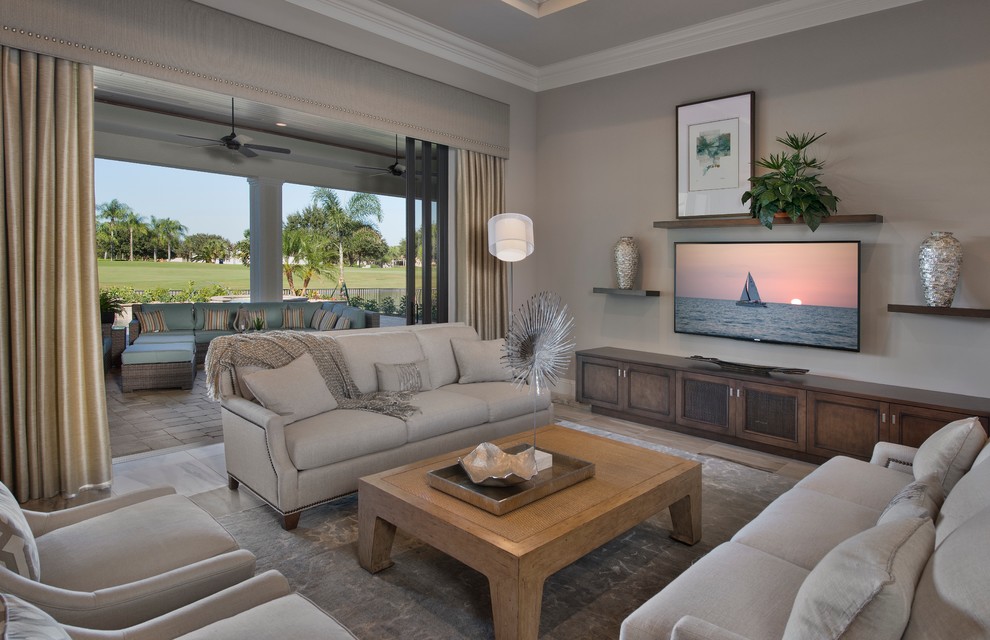 This is an example of a mid-sized mediterranean formal open concept living room in Miami with beige walls, no fireplace, a wall-mounted tv and multi-coloured floor.