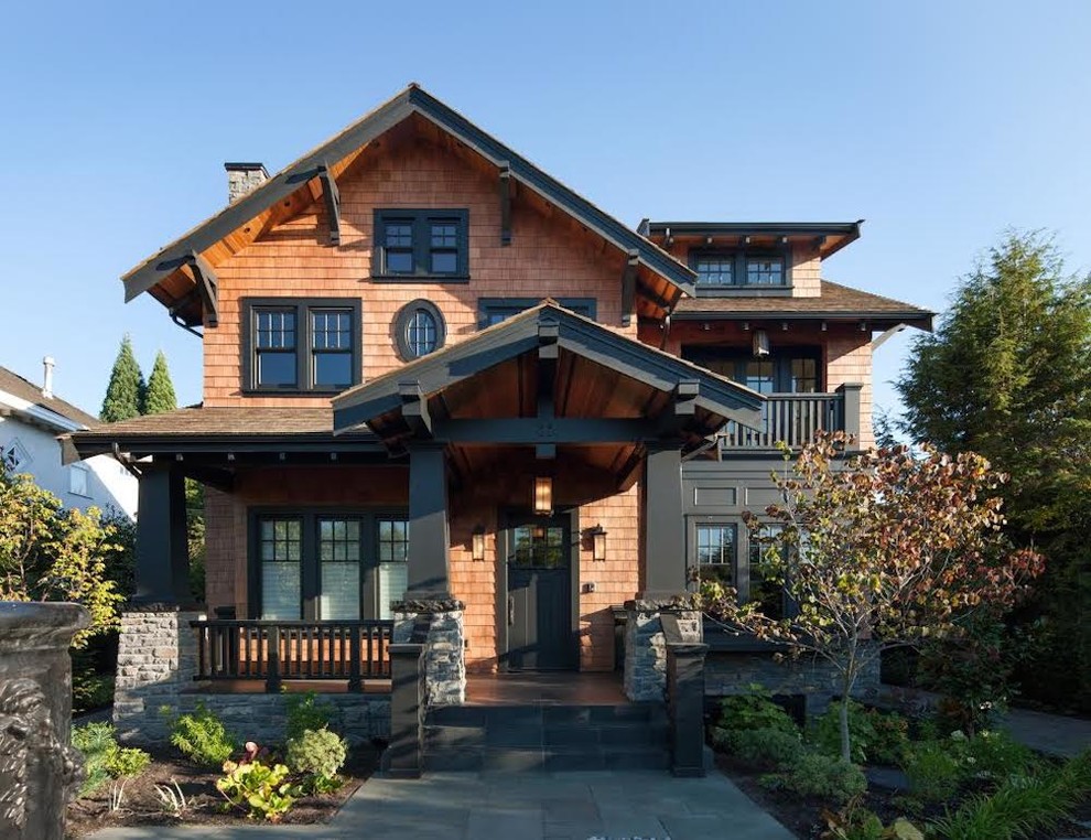 Design ideas for a large arts and crafts two-storey brown exterior in Vancouver.