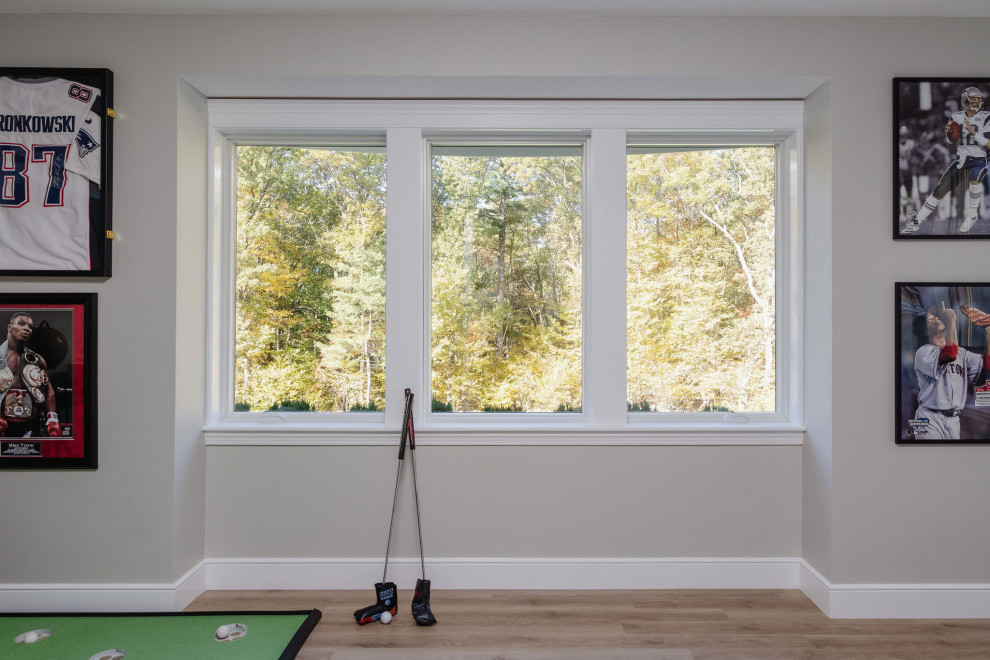 Example of a transitional family room design in Boston