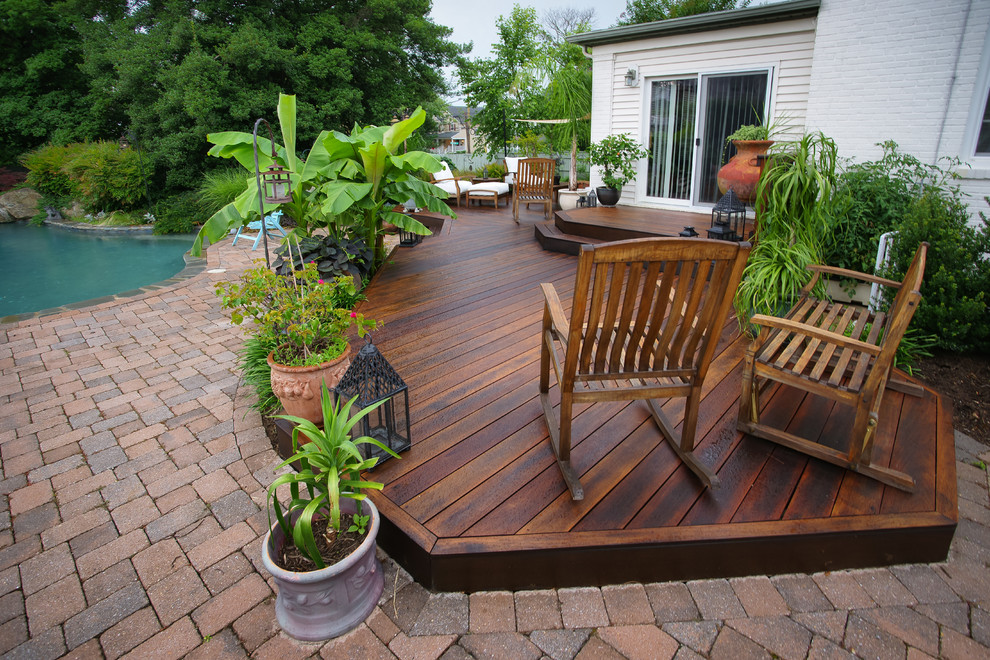 Photo of a large mediterranean backyard deck in DC Metro with no cover.