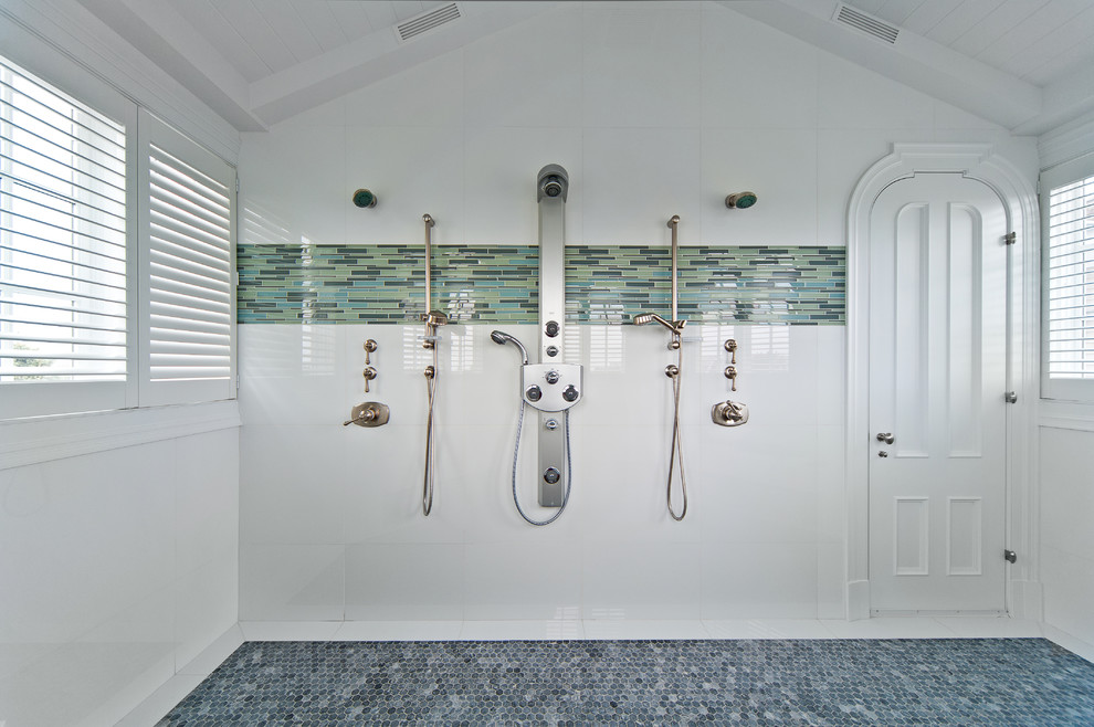 Beach style bathroom in New York with a double shower, mosaic tile and blue floor.