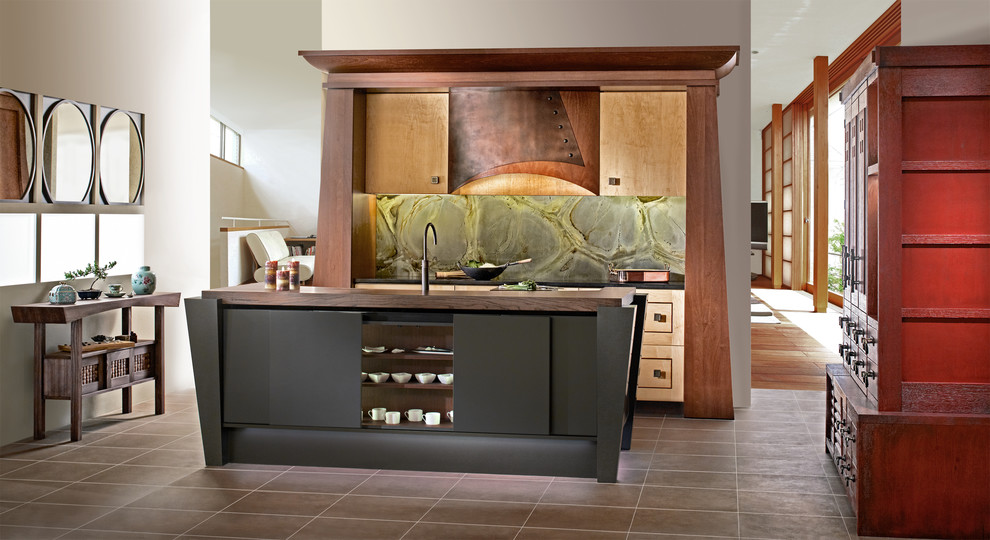 This is an example of a small asian u-shaped eat-in kitchen in Other with a drop-in sink, recessed-panel cabinets, light wood cabinets, green splashback, stone slab splashback, black appliances, with island and wood benchtops.