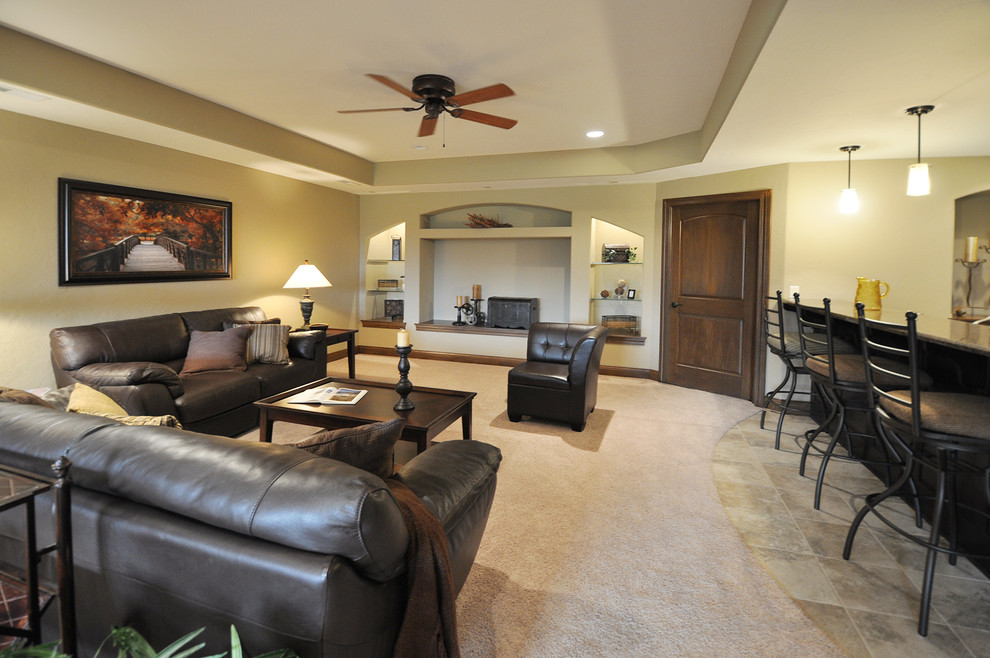 This is an example of an expansive traditional look-out basement in Milwaukee with beige walls and carpet.