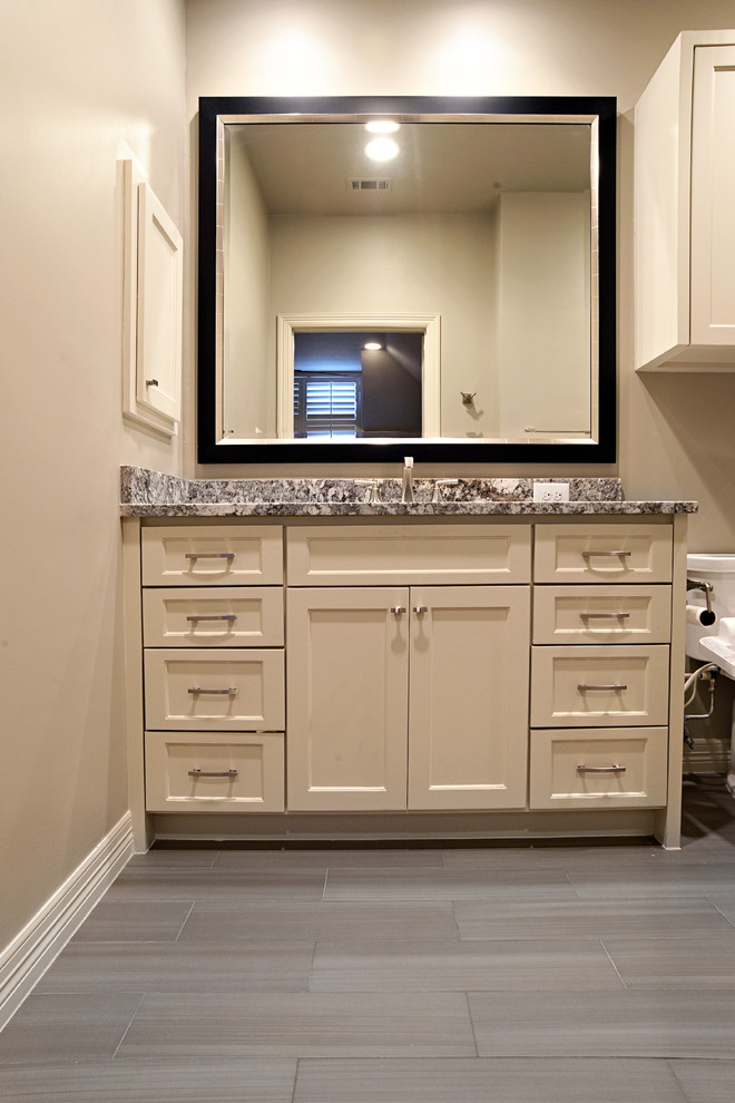 Inspiration for a mid-sized transitional master bathroom in Dallas with recessed-panel cabinets, beige cabinets, an alcove shower, a two-piece toilet, multi-coloured tile, matchstick tile, beige walls, plywood floors, an undermount sink and granite benchtops.