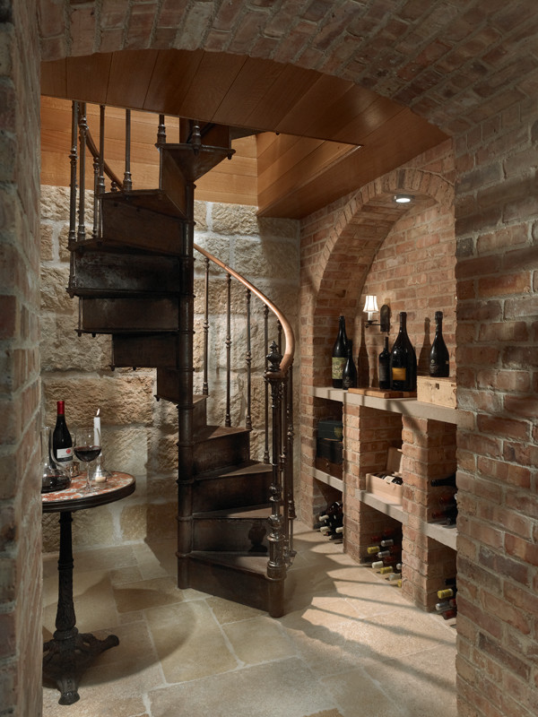 Inspiration for a mediterranean wine cellar in Chicago with travertine floors and display racks.
