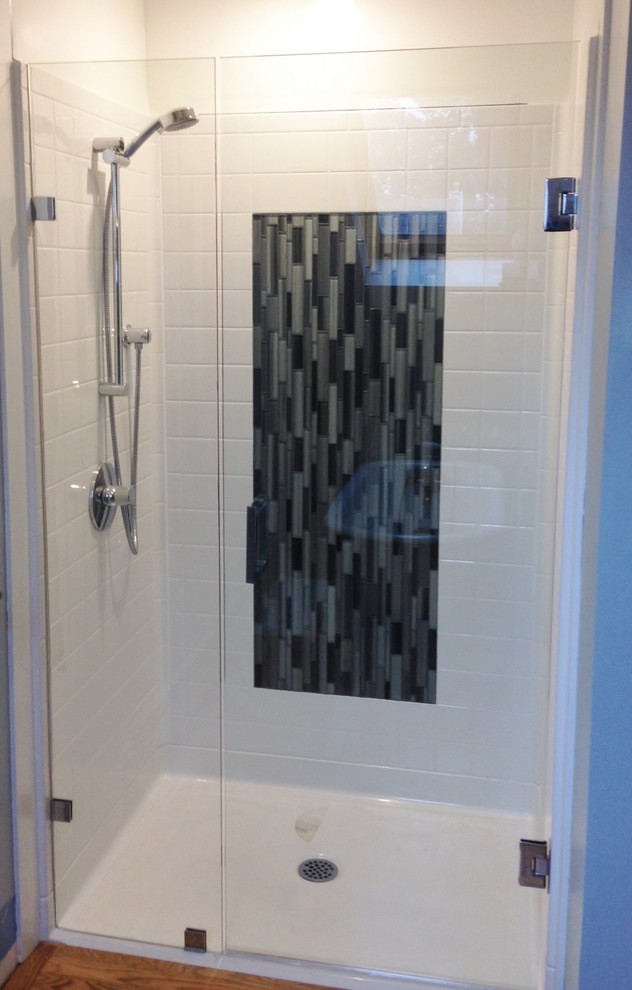 Photo of a bathroom with a curbless shower and an open shower.