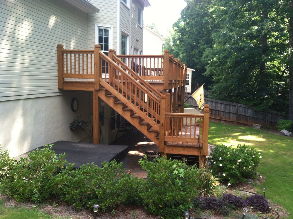 Photo of a mid-sized transitional backyard deck in Atlanta.