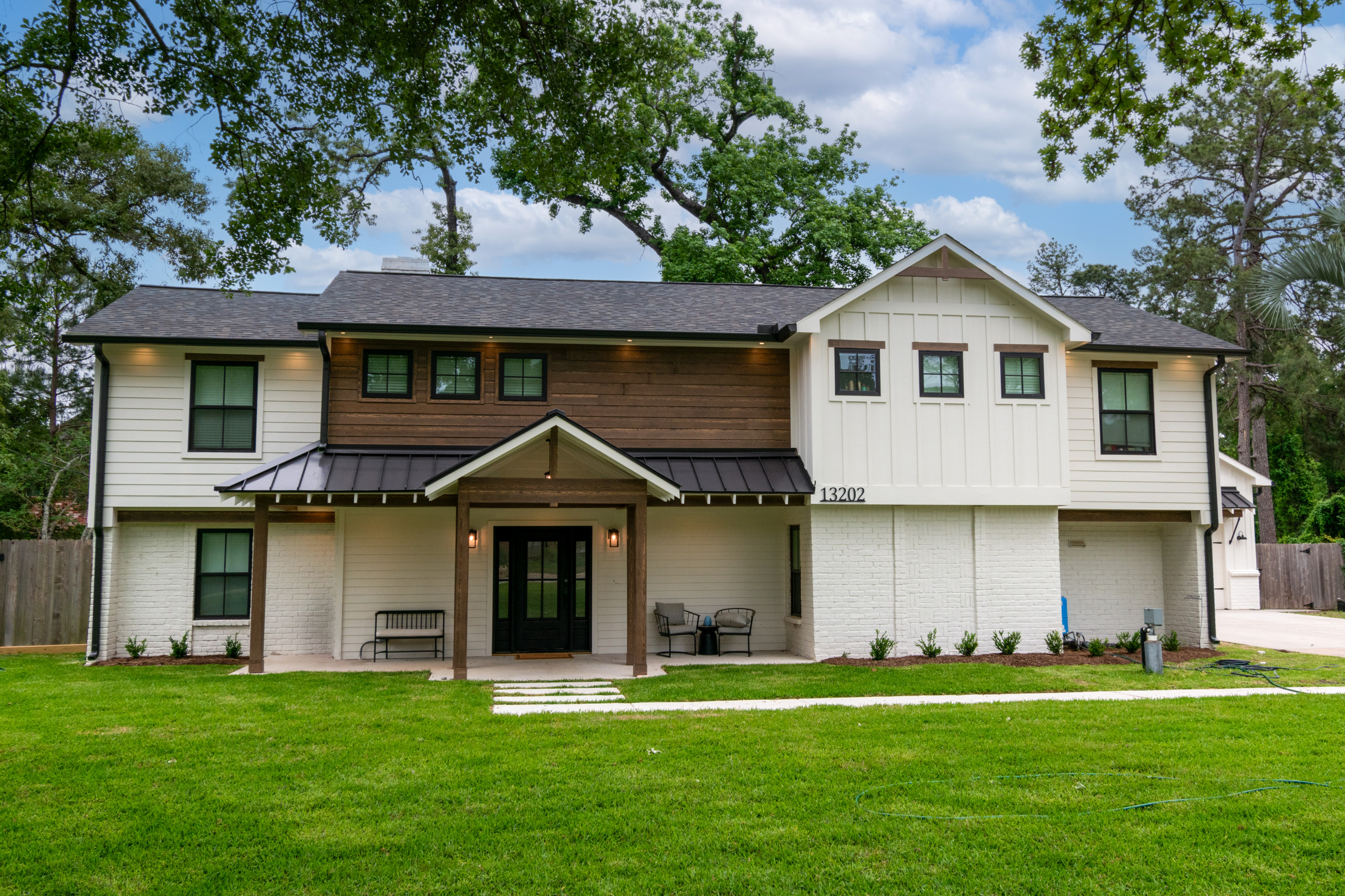 This was a full exterior rebuild due to 1 tree falling on the house and a second tree falling on the garage.  The exterior features 4 different types of siding including prefinished stained siding by