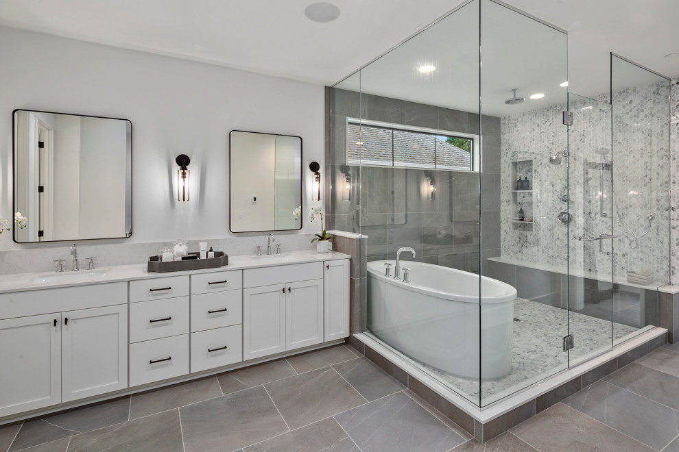 Inspiration for a large country master white tile and ceramic tile ceramic tile, gray floor and double-sink bathroom remodel in Seattle with recessed-panel cabinets, white cabinets, gray walls, an undermount sink, quartz countertops, a hinged shower door, white countertops and a built-in vanity
