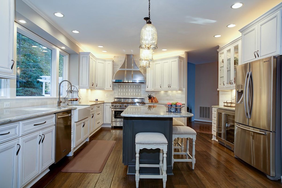 Eat-in kitchen - transitional u-shaped dark wood floor eat-in kitchen idea in Cedar Rapids with a farmhouse sink, flat-panel cabinets, white cabinets, marble countertops, stainless steel appliances and an island