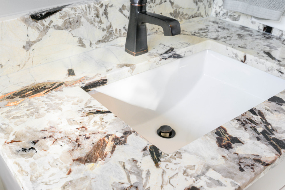 Bathroom - transitional 3/4 bathroom idea with gray cabinets, gray walls, an undermount sink and multicolored countertops
