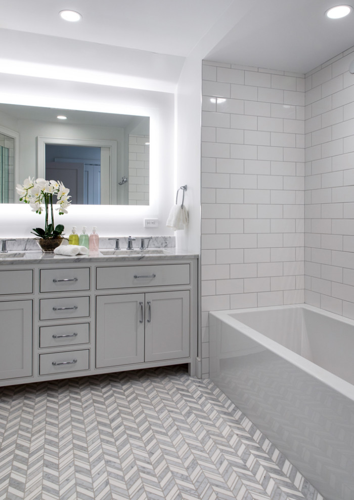 Inspiration for a mid-sized modern master bathroom in New York with shaker cabinets, white cabinets, a freestanding tub, a one-piece toilet, an undermount sink, a hinged shower door, a single vanity and a built-in vanity.