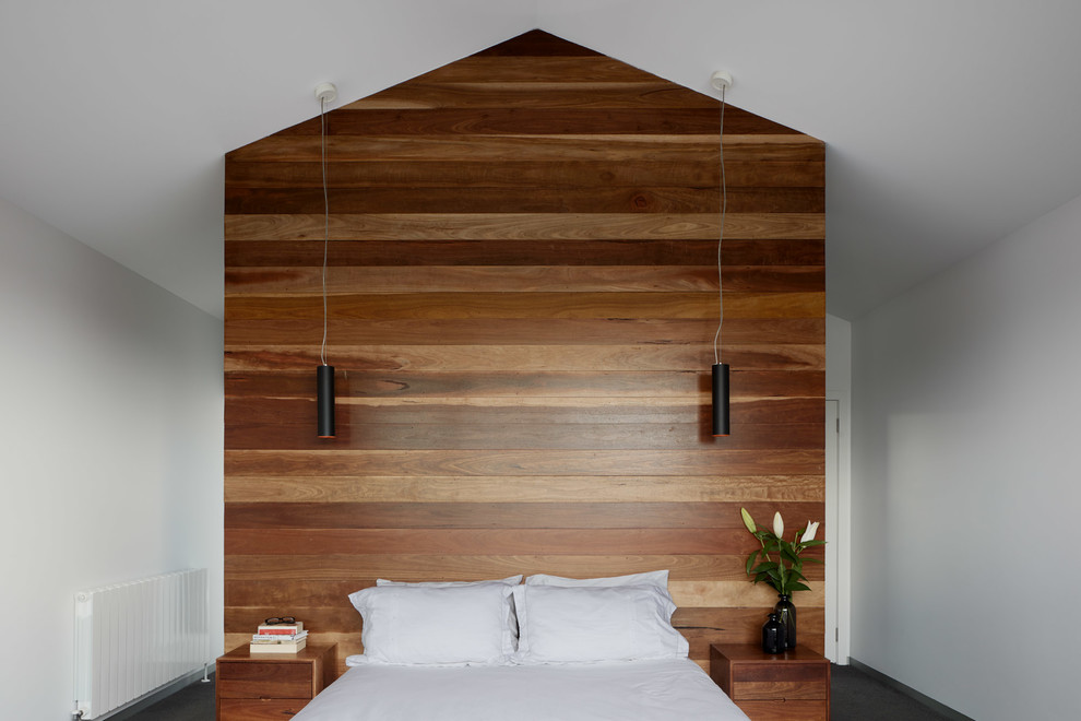 Mid-sized contemporary master bedroom in Melbourne with white walls, carpet and grey floor.