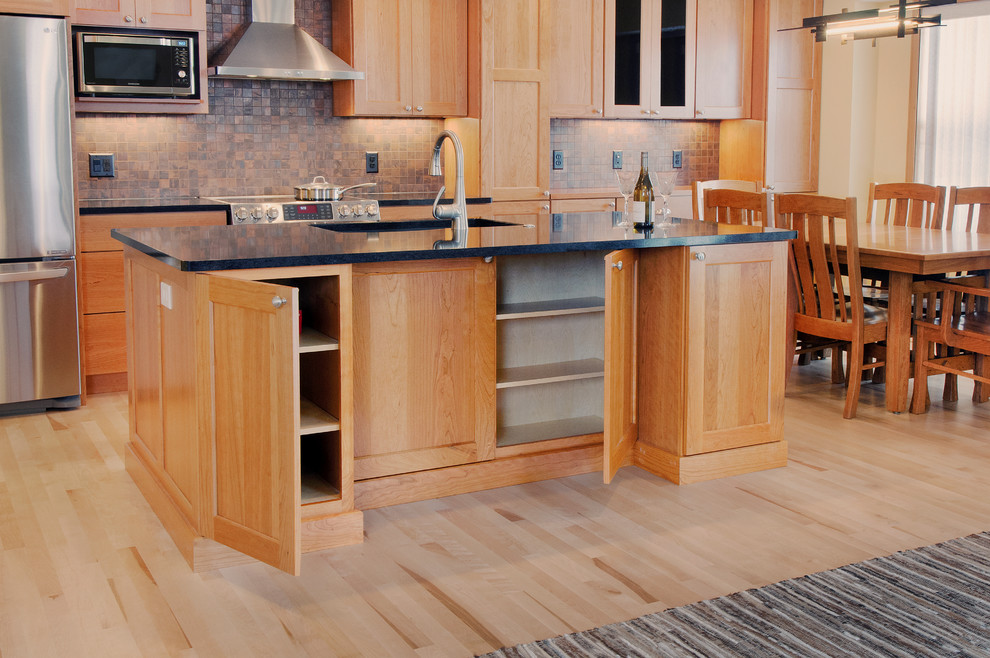 This is an example of an arts and crafts kitchen in Other with recessed-panel cabinets.