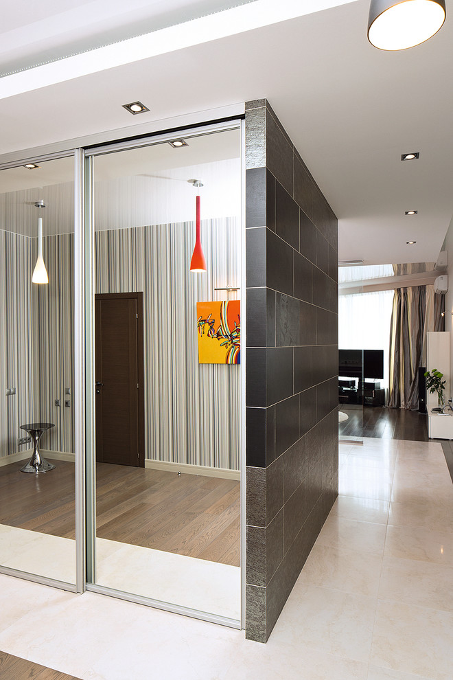 This is an example of a mid-sized contemporary hallway in Moscow with ceramic floors.