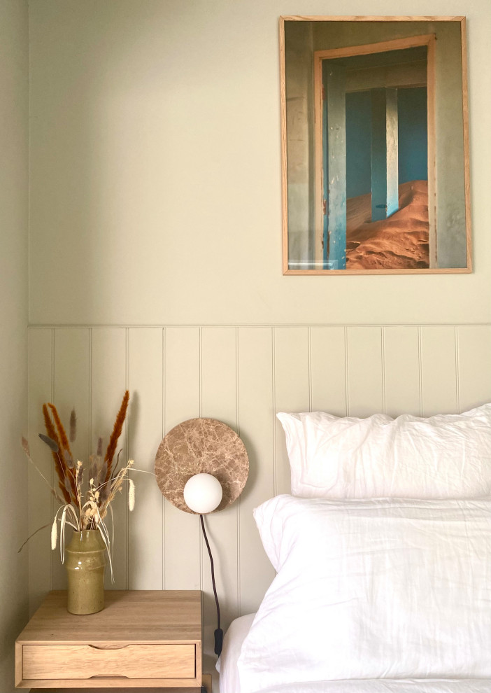 Inspiration for a small coastal guest bedroom in Kent with green walls, vinyl flooring, beige floors and tongue and groove walls.