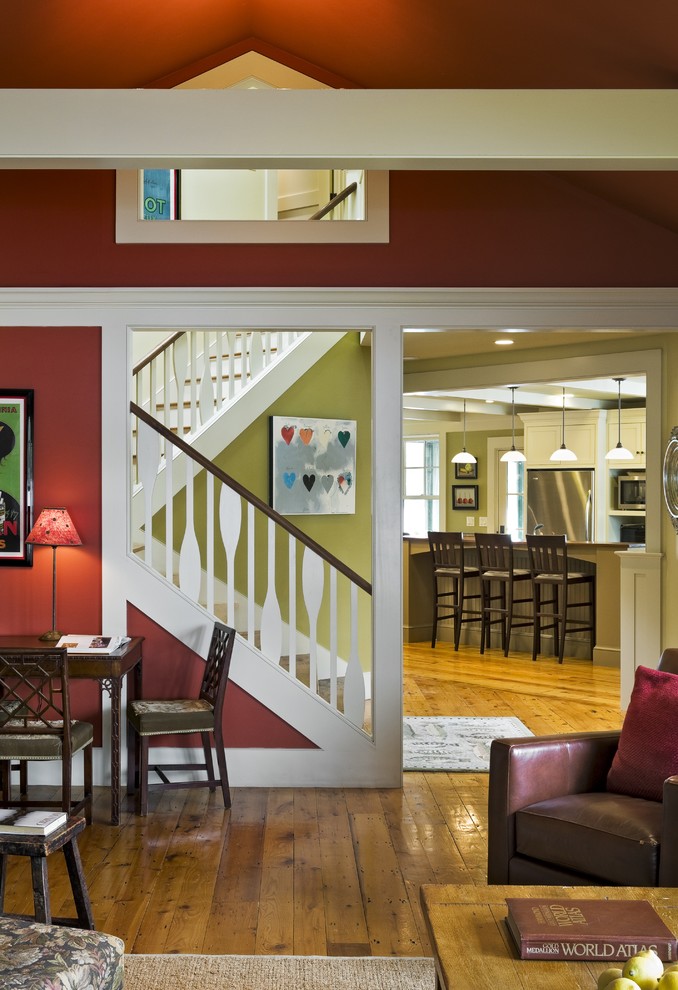Inspiration for a country living room in Burlington with red walls.