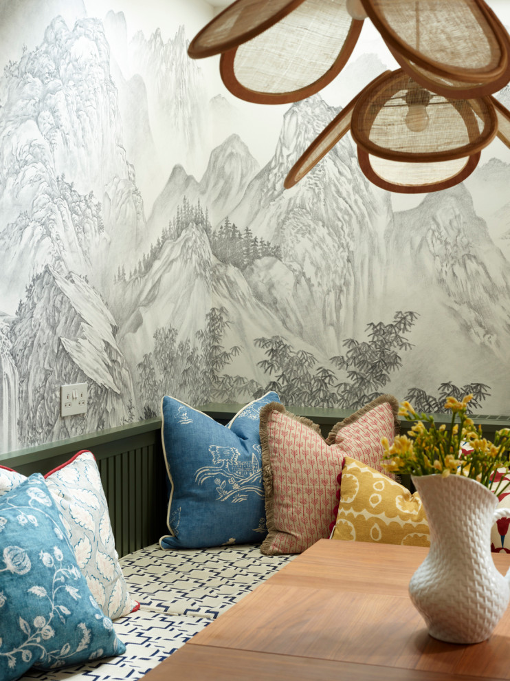This is an example of a modern dining room in London with wallpapered walls.