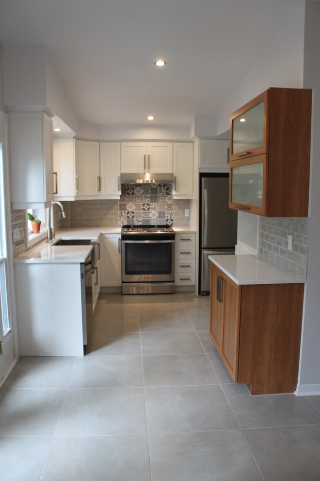 This is an example of a transitional kitchen in Montreal.
