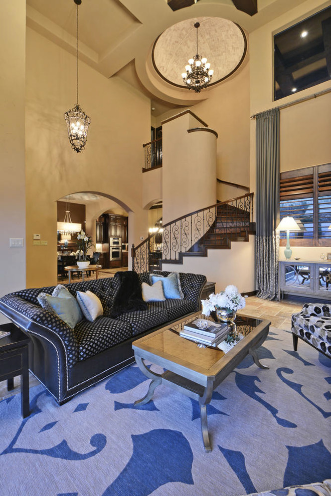 Expansive mediterranean formal open concept living room in Austin with beige walls and travertine floors.