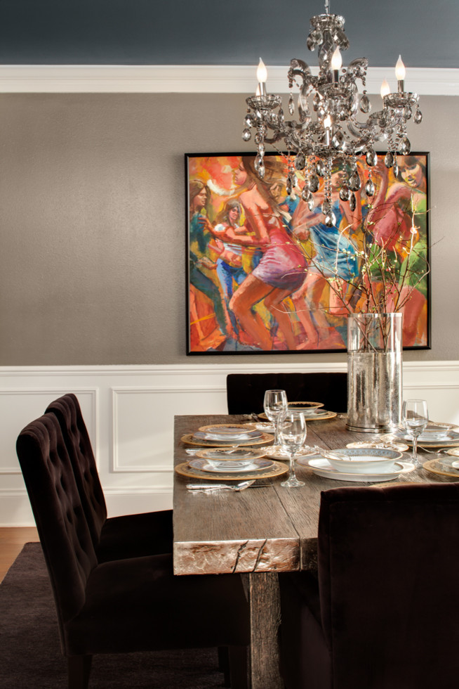 This is an example of a transitional dining room in Milwaukee.