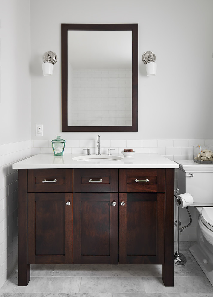 Example of a transitional white tile and subway tile gray floor and marble floor bathroom design with dark wood cabinets, a two-piece toilet, gray walls, white countertops and shaker cabinets