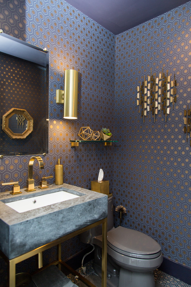 Trendy mosaic tile floor powder room photo in New York with blue walls, an undermount sink and gray countertops