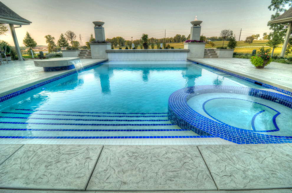 Hot tub - large transitional backyard concrete paver and rectangular natural hot tub idea in Cedar Rapids