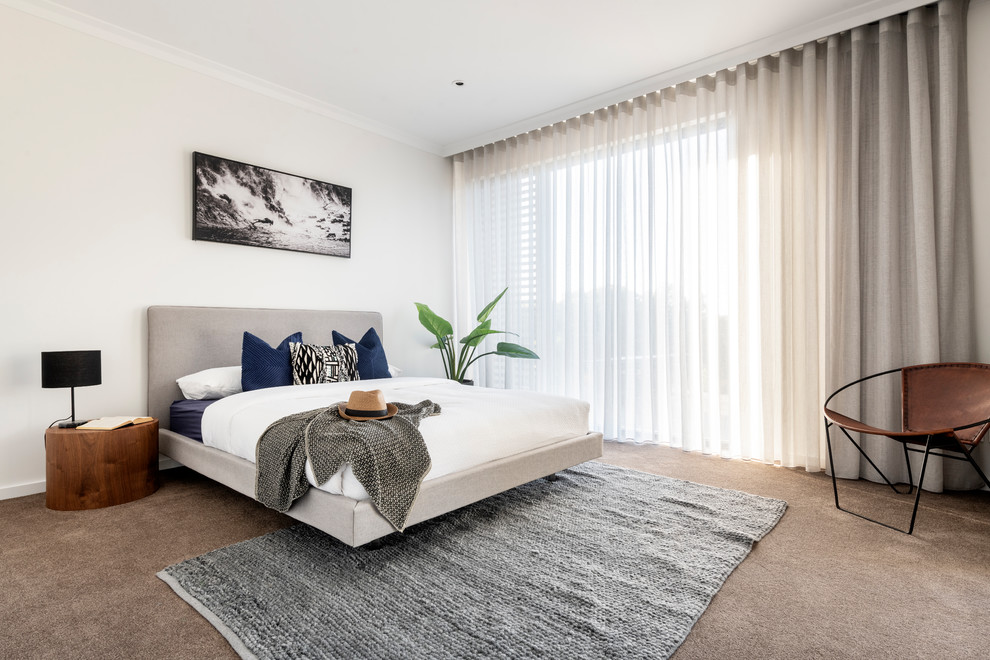 Inspiration for a contemporary bedroom in Perth with white walls, carpet and beige floor.