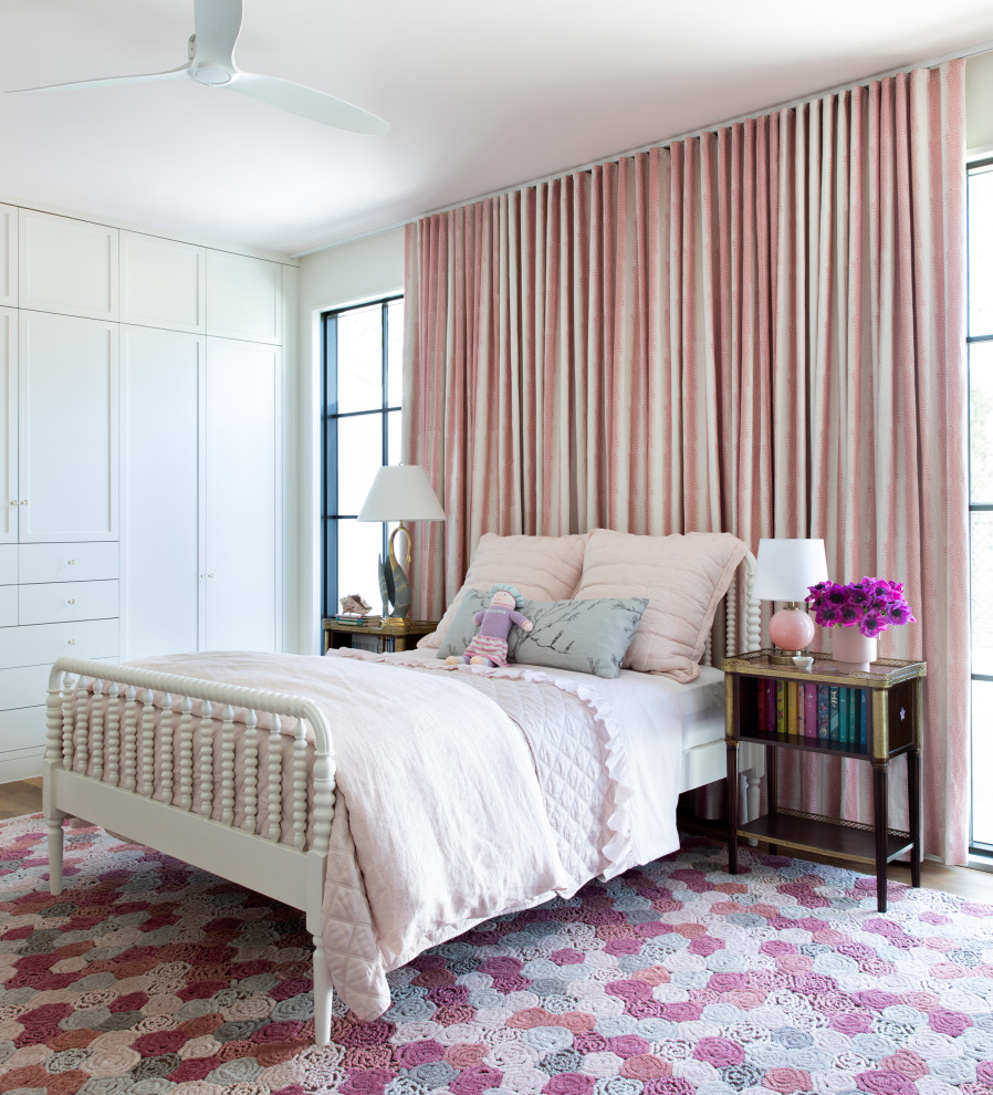 Classic kids' bedroom in Dallas with white walls, medium hardwood flooring and brown floors.