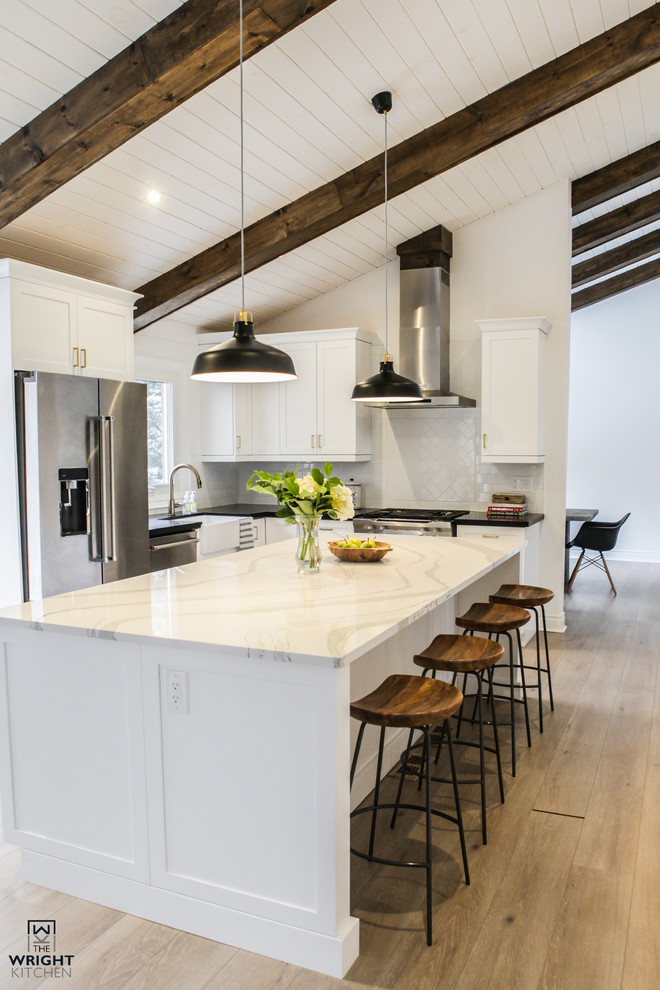 Example of a transitional kitchen design in Toronto