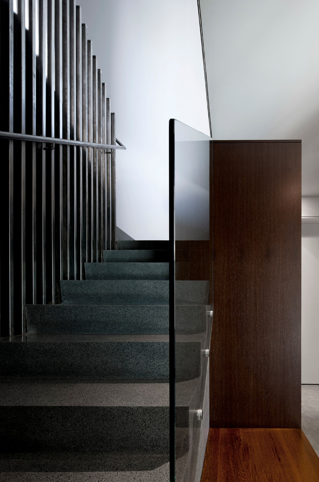 This is an example of a mid-sized modern concrete u-shaped staircase in Phoenix with concrete risers.