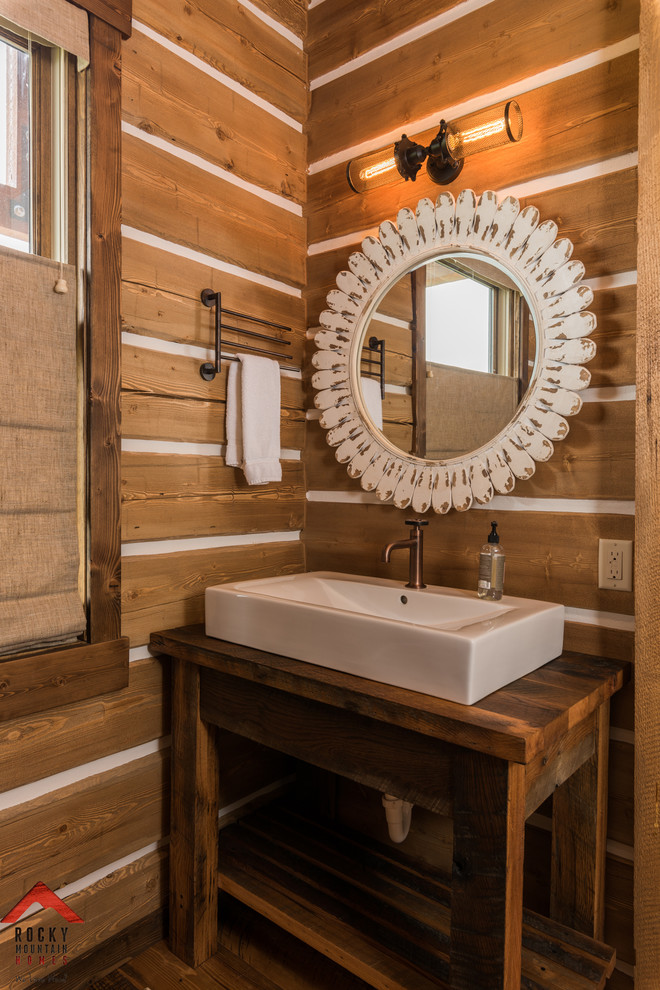 Inspiration for a small rustic 3/4 medium tone wood floor bathroom remodel with a trough sink and wood countertops